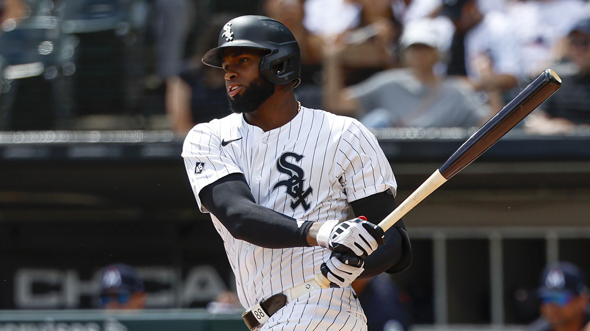 Chicago White Sox center fielder Luis Robert Jr. (88) singles against the Minnesota Twins during the first inning at Rate Field.