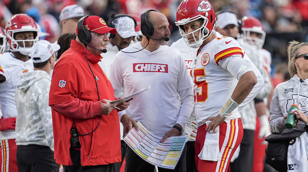 Kansas City Chiefs head coach Andy Reid talks with quarterback Patrick Mahomes (15) during a time out during the second half against the Carolina Panthers at Bank of America Stadium.