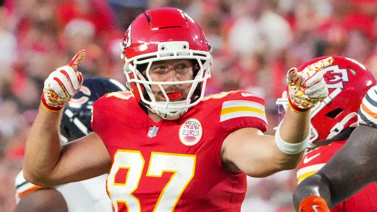 Kansas City Chiefs tight end Travis Kelce (87) celebrates after a catch and run against the Chicago Bears during the first half of the game at GEHA Field at Arrowhead Stadium.
