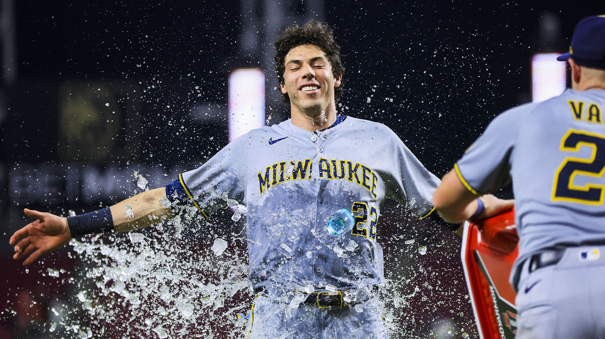 Milwaukee Brewers first baseman Andrew Vaughn (28) dumps water on designated hitter Christian Yelich (22) after the victory over the Cincinnati Reds at Great American Ball Park.