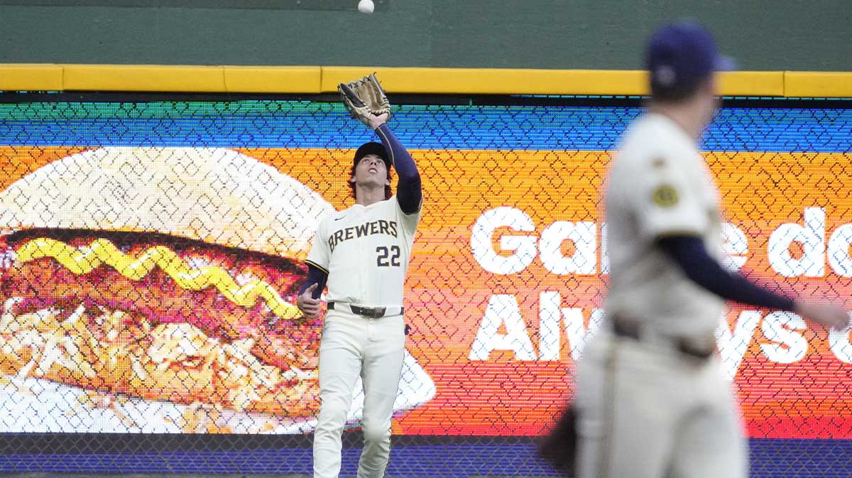 Aug 27, 2025; Milwaukee, Wisconsin, USA; Milwaukee Brewers outfielder Christian Yelich (22) catches a fly ball against the Arizona Diamondbacks in the first inning at American Family Field.
