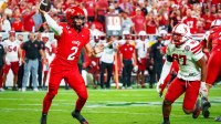 Cincinnati Bearcats quarterback Brendan Sorsby (2) passes against Nebraska Cornhuskers defensive lineman Keona Davis (97) during the second quarter at GEHA Field at Arrowhead Stadium.