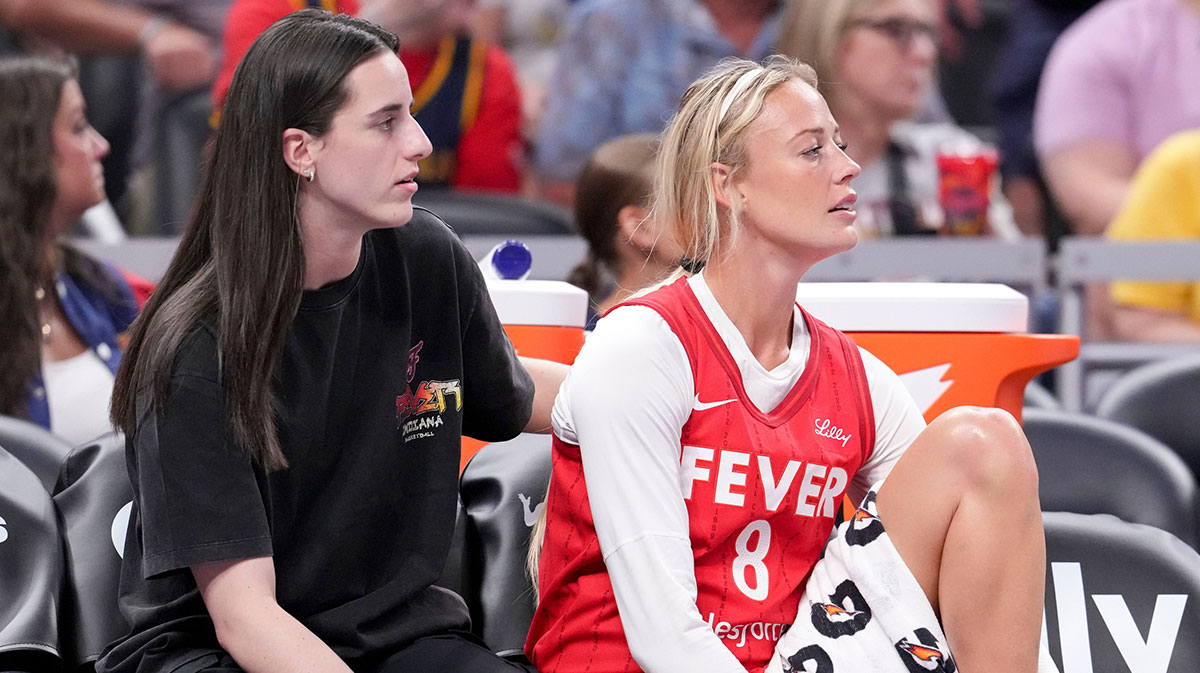 Indiana Fever guard Caitlin Clark (22) and guard Sophie Cunningham (8) watch from the bench during the first half of a game against the Washington Mystics on Friday, Aug. 15, 2025, at Gainbridge Fieldhouse in Indianapolis.