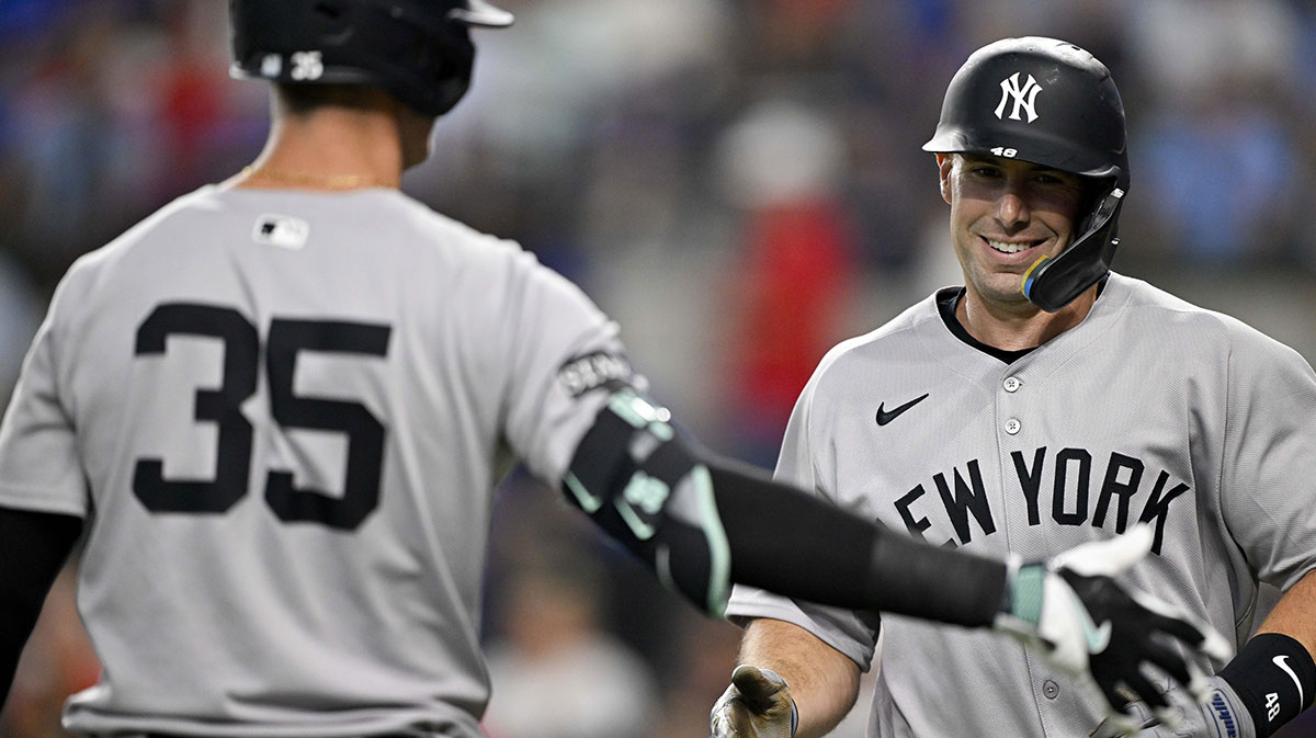 New York Yankees first baseman Paul Goldschmidt (48) celebrates with center fielder Cody Bellinger (35) after Goldschmidt hits a leadoff home run against the Texas Rangers during the first inning at Globe Life Field
