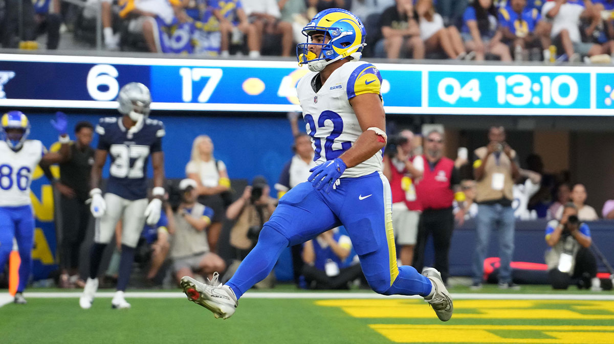 Los Angeles Rams running back Cody Schrader (32) scores on a 9-yard touchdown reception in the fourth quarter against the Dallas Cowboys at SoFi Stadium.