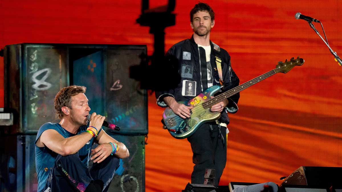 Coldplay's Chris Martin and Guy Berryman in concert after the Astronomer CEO cheating scandal caught on their jumbotron.