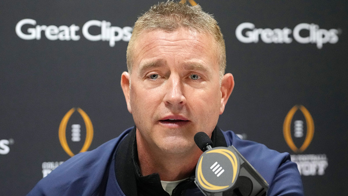 Kirk Herbstreit talks to the media during 2025 CFP National Championship Media Day at Georgia World Congress Center, Building A.