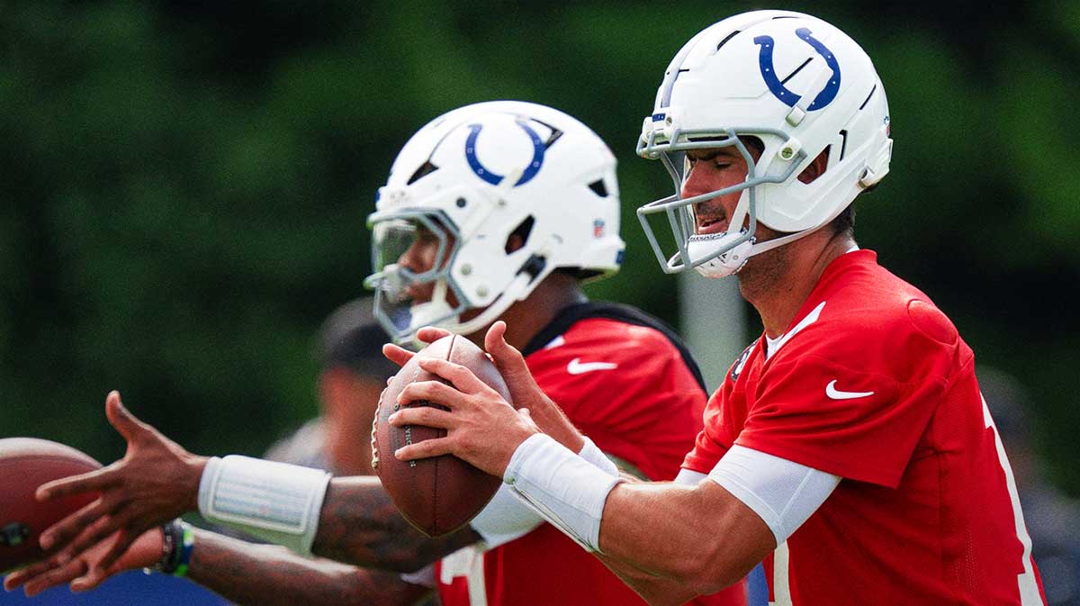Indianapolis Colts quarterbacks Anthony Richardson Sr. (5) and Daniel Jones (17) pass Friday, July 25, 2025, during training camp held at Grand Park in Westfield.