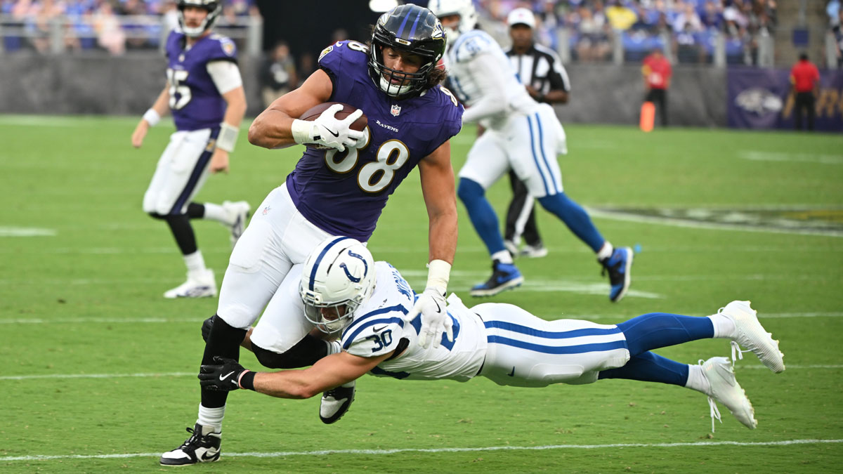 Baltimore Ravens tight end Charlie Kolar (88) is tackled by Indianapolis Colts safety Hunter Wohler (30) during the first quarter at M&T Bank Stadium.