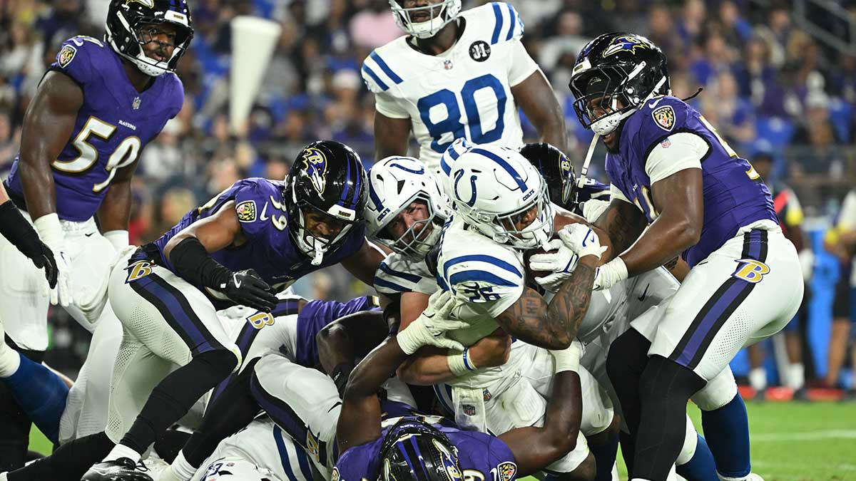 Indianapolis Colts running back Khalil Herbert (26) scores a touchdown while being tackled against the Baltimore Ravens during the third quarter