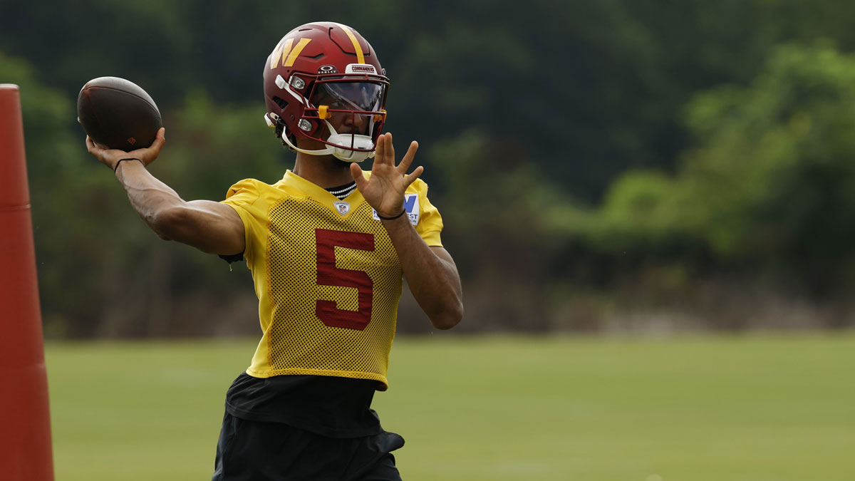 Commanders quarterback Jayden Daniels (5) passes a ball during practice on day one of training camp at OrthoVirginia Training Center at Commanders Park