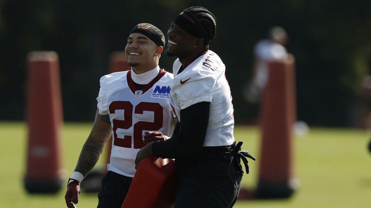Commanders running back Brian Robinson Jr. (8) jokes with Commanders cornerback Car'lin Vigers (22) during practice on day two of training camp at OrthoVirginia Training Center at Commanders Park