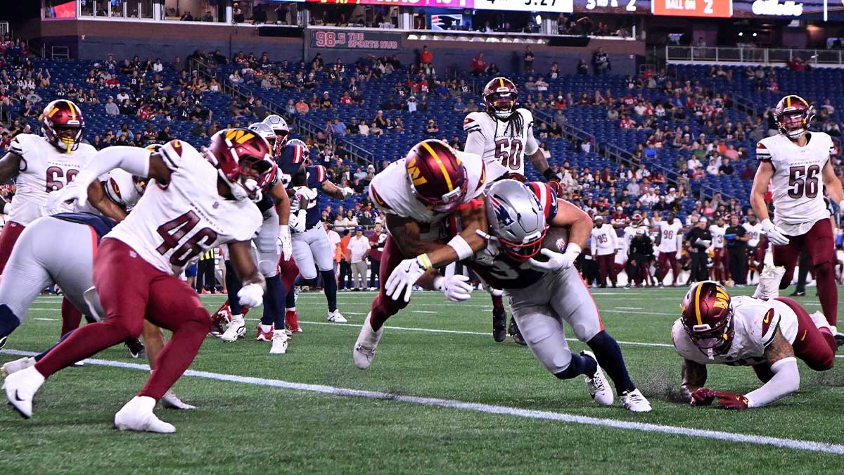 New England Patriots running back Lan Larison (34) runs for a touchdown against the Washington Commanders during the second half at Gillette Stadium.