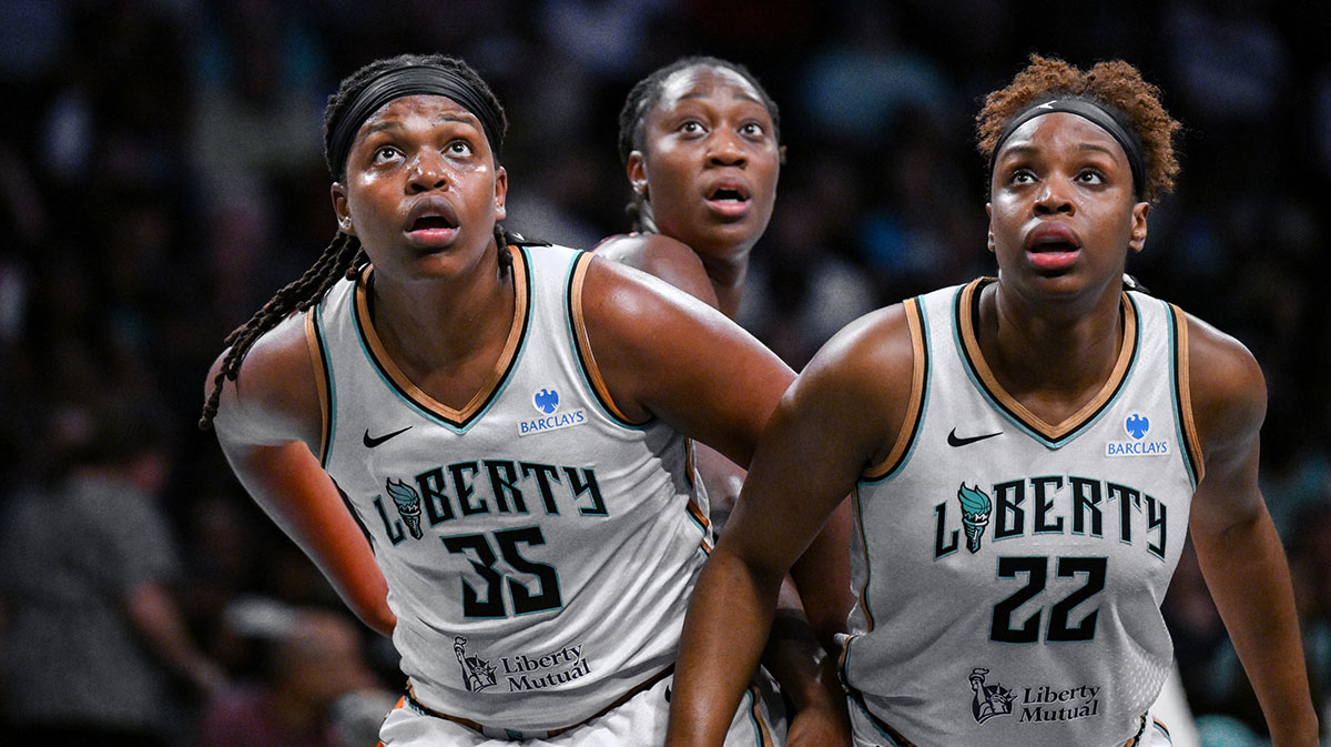 New York Liberty center Jonquel Jones (35) and forward Kennedy Burke (22) box out Connecticut Sun center Tina Charles (31) during the second half at Barclays Center.