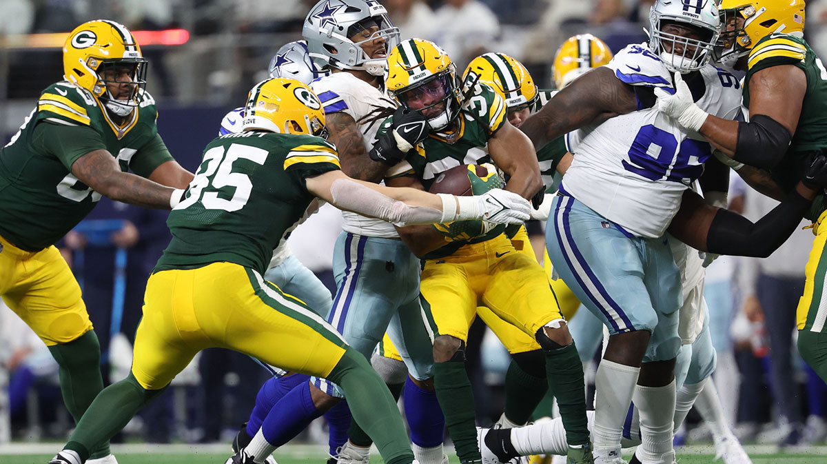 Dallas Cowboys linebacker Micah Parsons (11) tackles Green Bay Packers running back Aaron Jones (33) in the first half of the 2024 NFC wild card game at AT&T Stadium