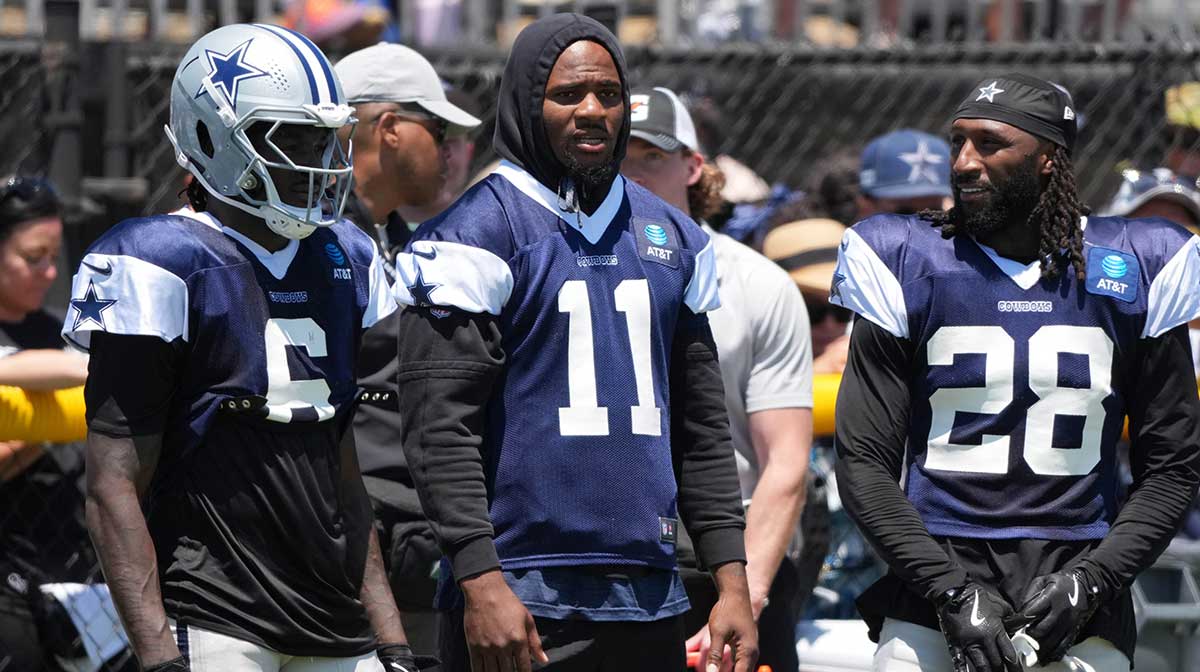 Dallas Cowboys safety Donovan Wilson (6), defensive end Micah Parsons (11) and safety Malik Hooker (28) watch from the sidelines at training camp at the River Ridge Fields.