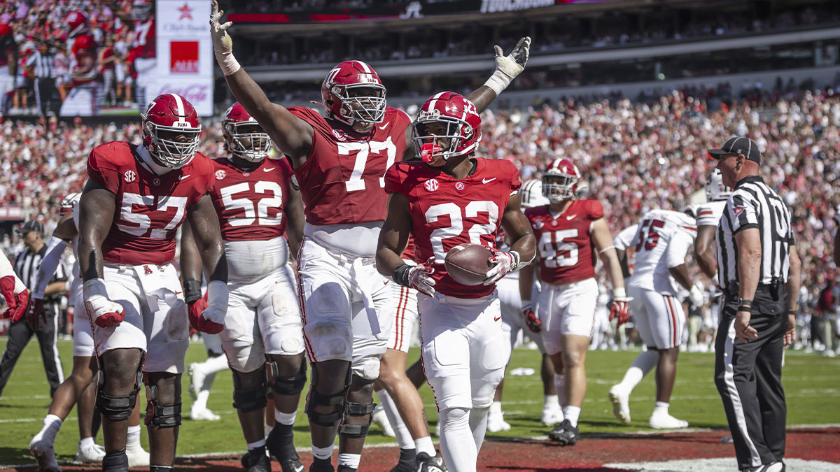 Alabama Crimson Tide offensive lineman Jaeden Roberts (77) and his teammates react after Alabama Crimson Tide running back Justice Haynes (22) scores a touchdown agains the South Carolina Gamecocks during the second quarter at Bryant-Denny Stadium.
