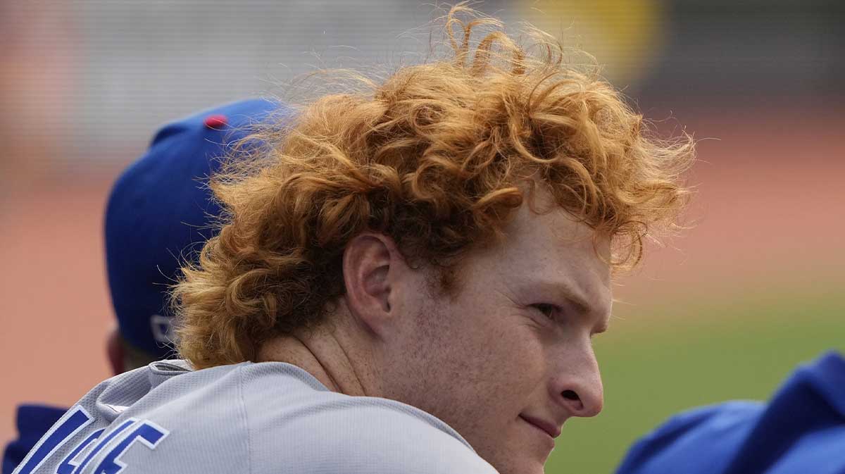 Chicago Cubs designated hitter Owen Caissie (19) looks towards the field from the dugout during the eighth inning against the Toronto Blue Jays at Rogers Centre.