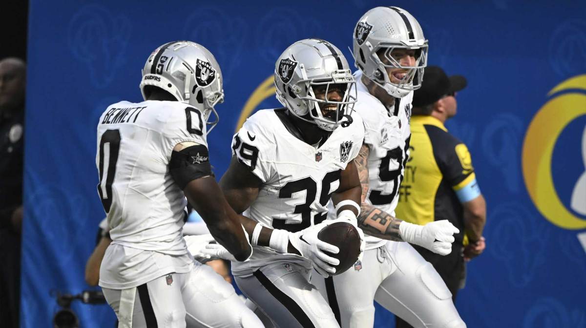 Las Vegas Raiders cornerback Nate Hobbs (39) celebrates intercepting a Los Angeles Rams quarterback Matthew Stafford (not pictured) pass during the third quarter at SoFi Stadium. Left is Las Vegas Raiders cornerback Jakorian Bennett (0), right is defensive end Maxx Crosby (98).
