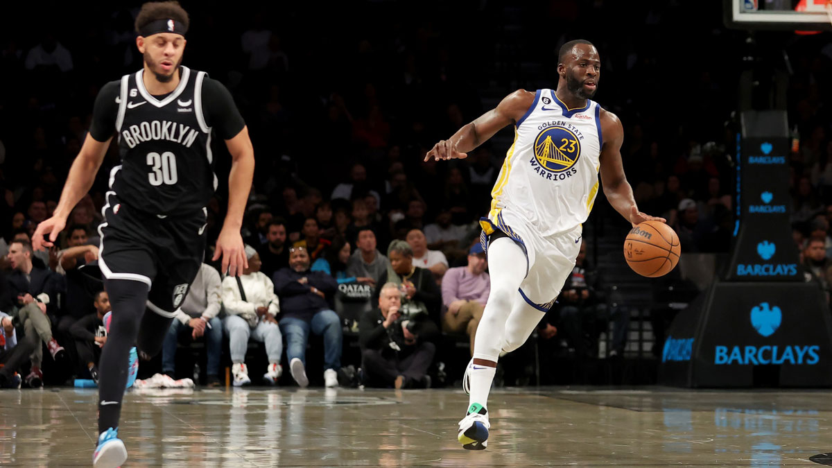 Golden State Warriors forward Draymond Green (23) brings the ball up court against Brooklyn Nets guard Seth Curry (30) during the second quarter at Barclays Center.