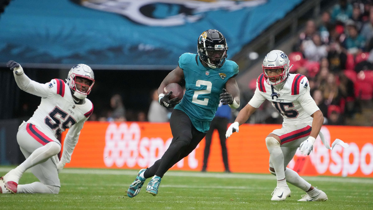 Jacksonville Jaguars running back D'Ernest Johnson (2) carries the ball against the New England Patriots in the second half of an NFL International Series game at Wembley Stadium.