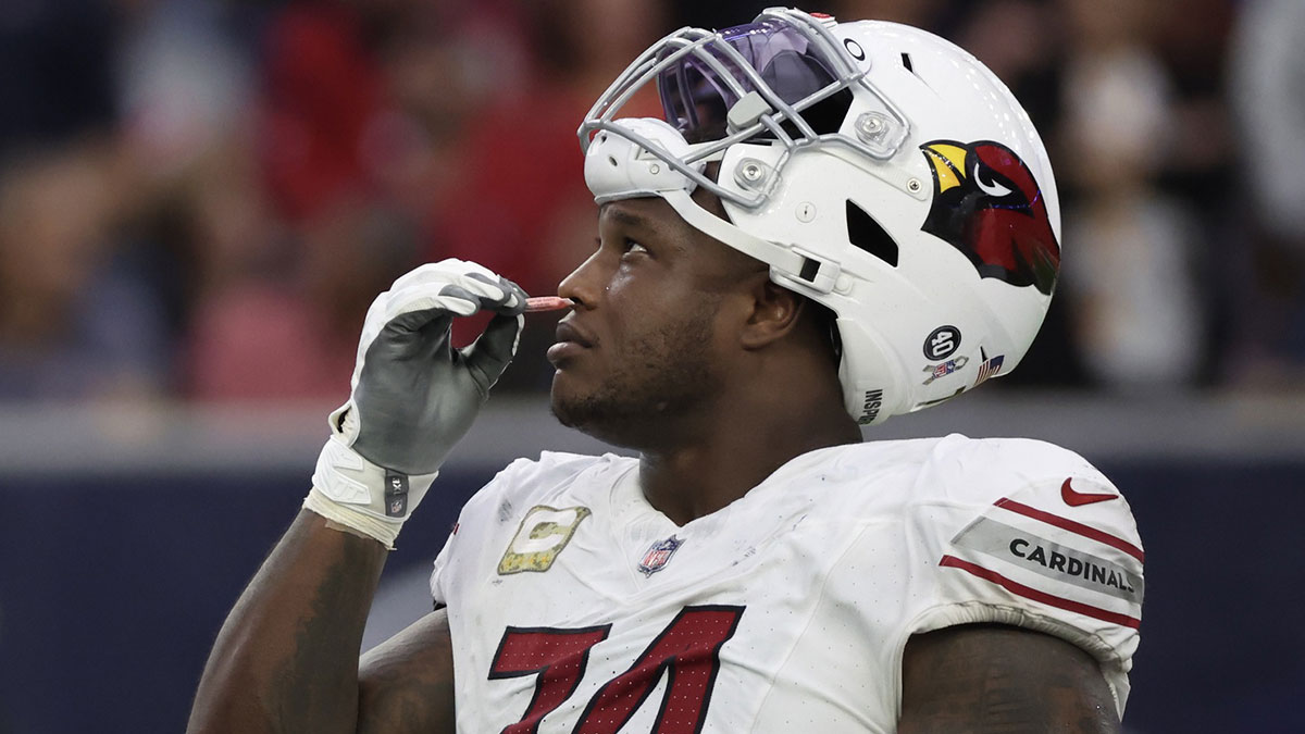 Arizona Cardinals offensive tackle D.J. Humphries (74) smells smelling salts as he and the Houston Texans waits for a call in the second half at NRG Stadium.