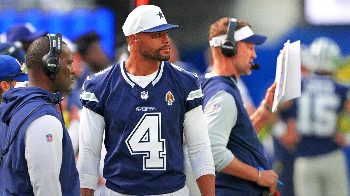 Dallas Cowboys quarterback Dak Prescott (4) looks on from the sidelines during the game against the Los Angeles Rams at SoFi Stadium.