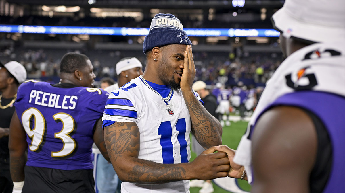Dallas Cowboys defensive end Micah Parsons (11) talks with Baltimore Ravens linebacker Odafe Oweh (99) after the game at AT&T Stadium.