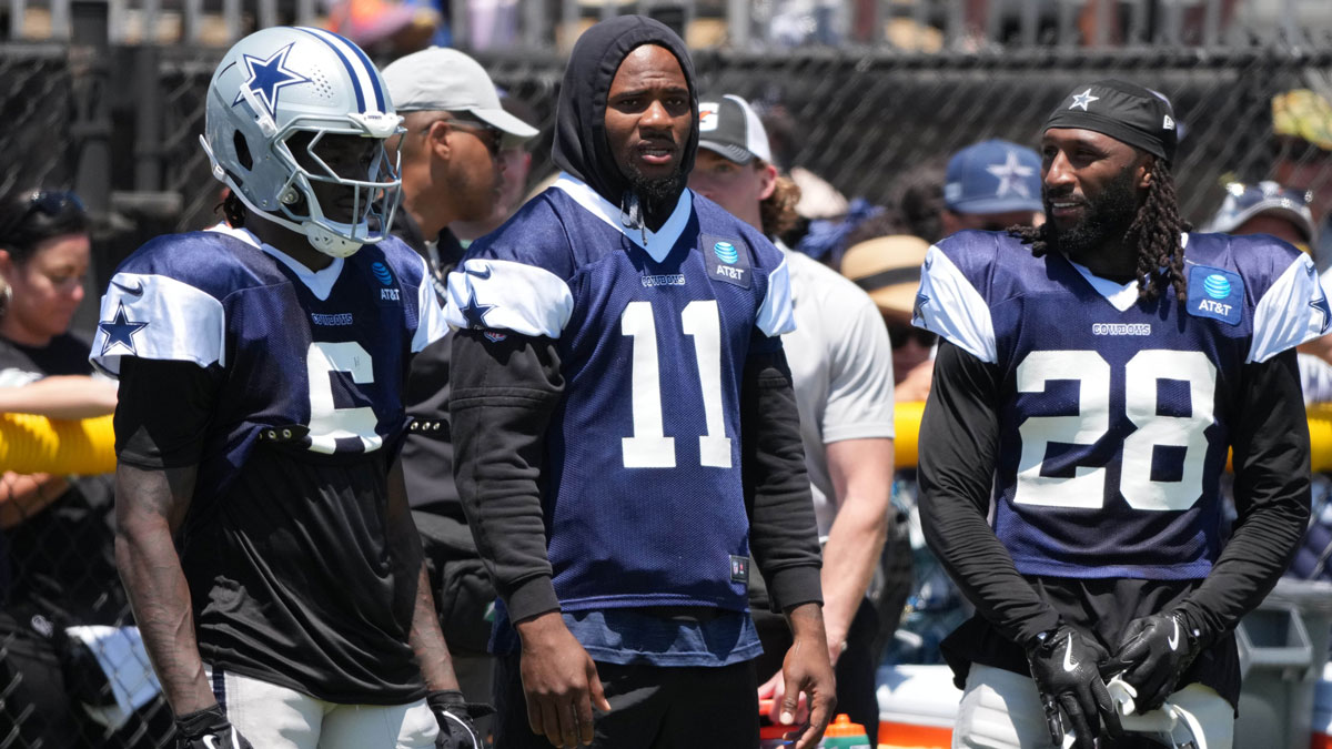 Dallas Cowboys safety Donovan Wilson (6), defensive end Micah Parsons (11) and safety Malik Hooker (28) watch from the sidelines at training camp at the River Ridge Fields.