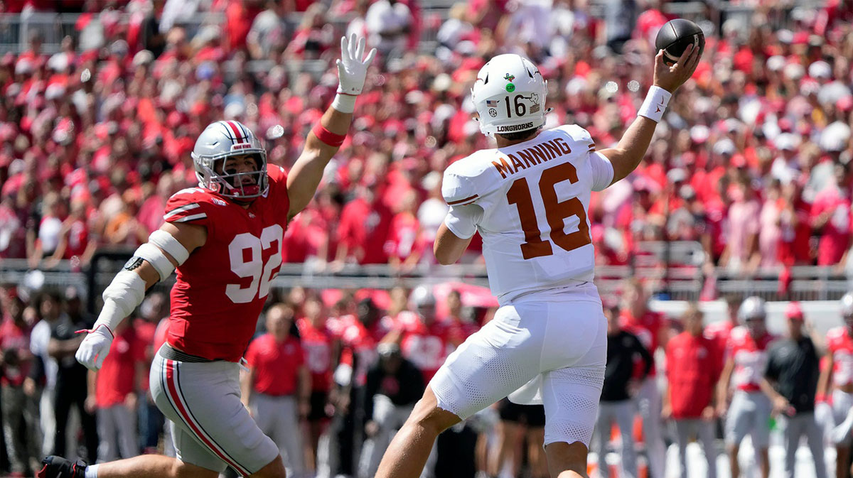 Texas Longhorns quarterback Arch Manning (16) throws the ball against Ohio State Buckeyes defensive end Caden Curry (92) in the first quarter of their game at Ohio Stadium in Columbus, Ohio on Aug 30, 2025.