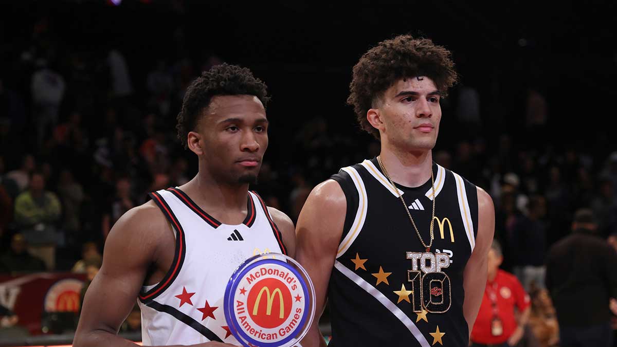 Apr 1, 2025; Brooklyn, NY, USA; McDonald's All American West guard Darryn Peterson (22) and McDonald's All American East forward Cameron Boozer (12) pose for photos after the game at Barclays Center. Mandatory Credit: Pamela Smith-Imagn Images