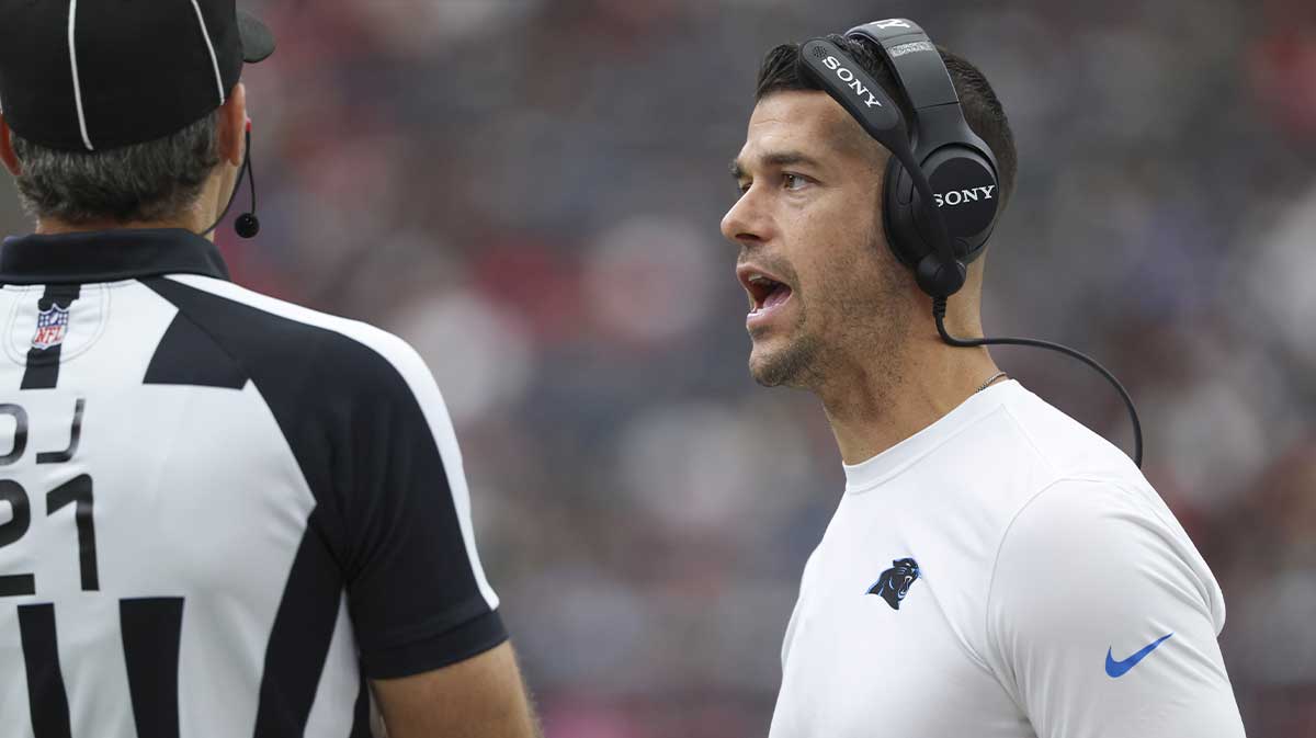 Carolina Panthers head coach Dave Canales talks with an official during the first quarter against the Houston Texans