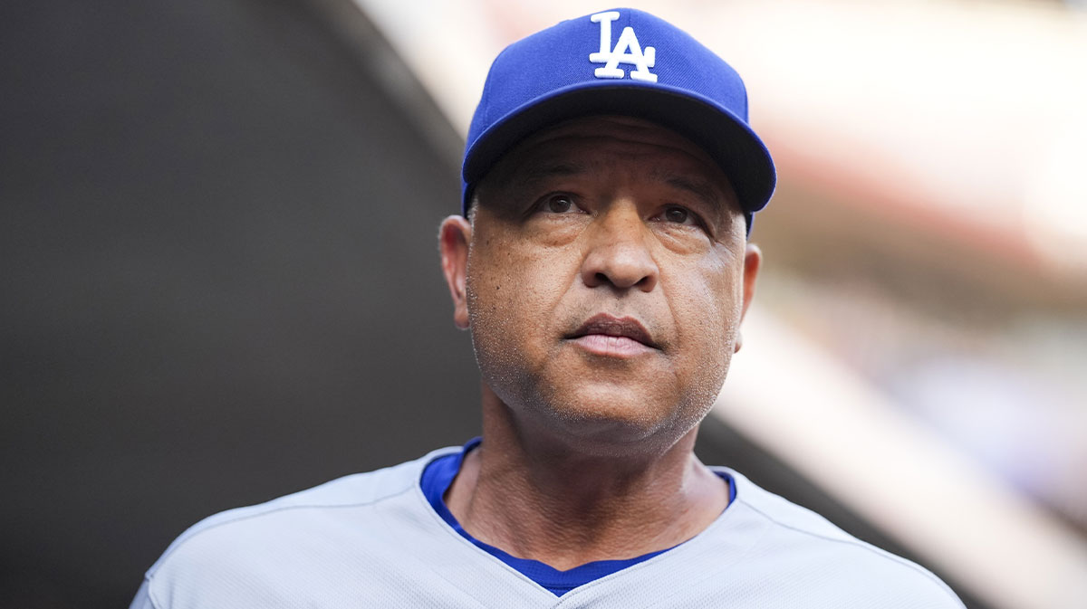 Los Angeles Dodgers manager Dave Roberts (30) stands in the dugout before the game against the Cincinnati Reds at Great American Ball Park.