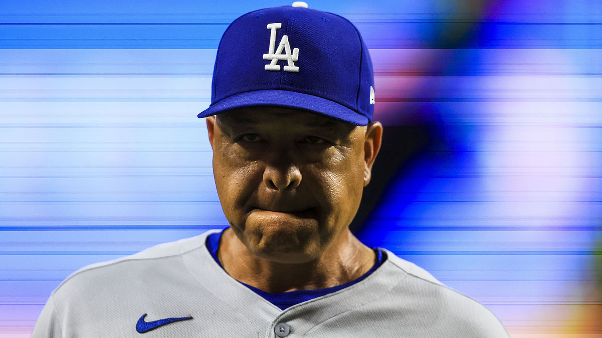 Los Angeles Dodgers manager Dave Roberts (30) walks off the field during a pitching change in the ninth inning against the Cincinnati Reds at Great American Ball Park.