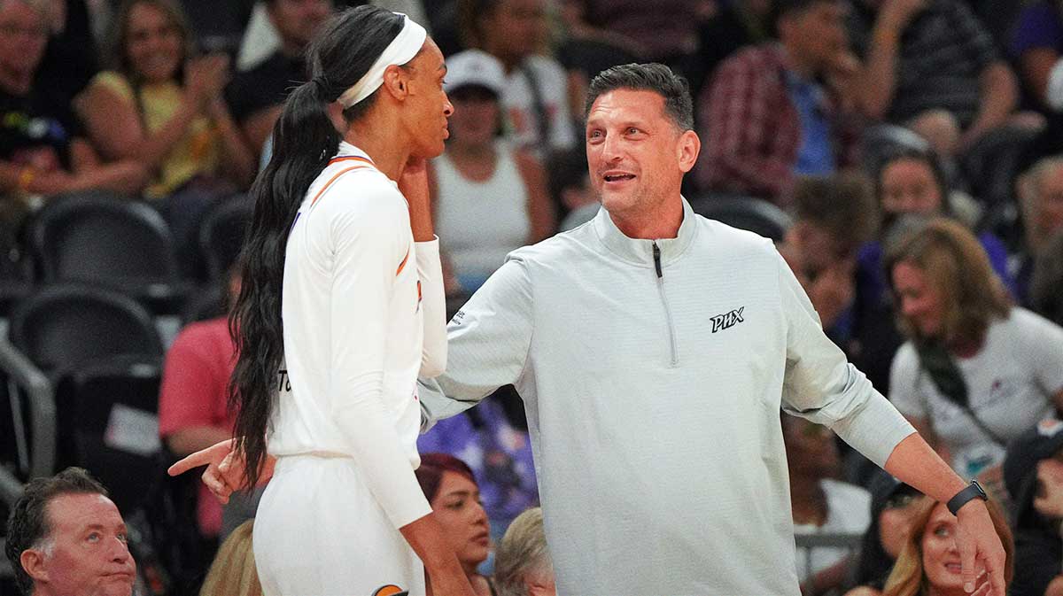 Phoenix Mercury head coach Nate Tibbitts talks to forward DeWanna Bonner (14) against the Connecticut Sun in the second half at Footprint Center.