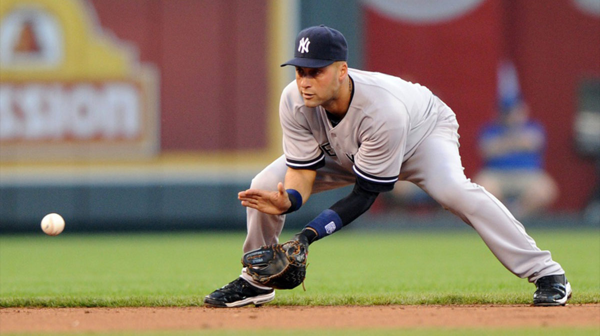 New York Yankees shortstop Derek Jeter (2) fields a round ball during second inning against the Kansas City Royals at Kauffman Stadium.