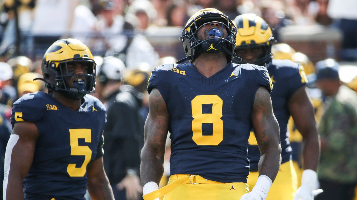 Michigan defensive end Derrick Moore (8) celebrates a tackle against UNLV during the first half at Michigan Stadium
