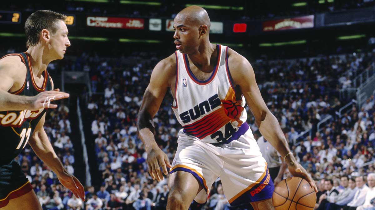 Phoenix Suns forward Charles Barkley (34) is defended by Seattle Supersonics forward Detlef Schrempf (11) at America West Arena.