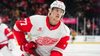 Detroit Red Wings defenseman Simon Edvinsson (77) warms up before a game against the Vegas Golden Knights at T-Mobile Arena.