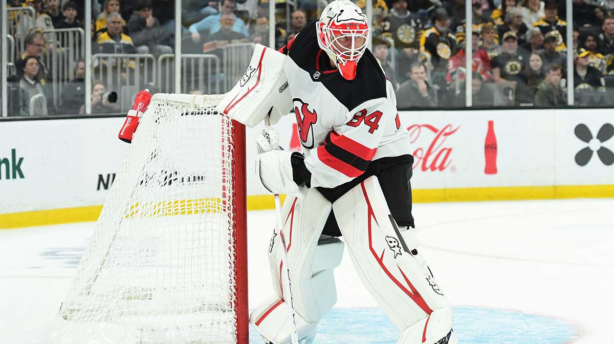 New Jersey Devils goaltender Jake Allen (34) handles the puck during the third period against the Boston Bruins at TD Garden.