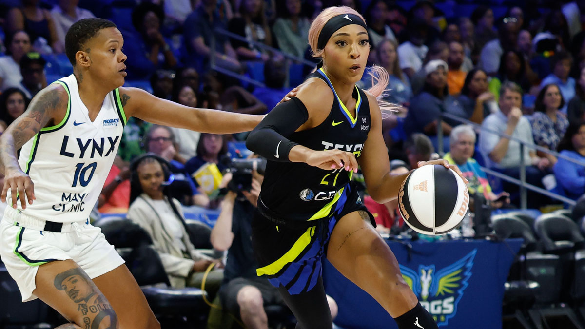 Dallas Wings guard DiJonai Carrington (21) drives to the basket ahead of Minnesota Lynx guard Courtney Williams (10) during the first half at College Park Center.