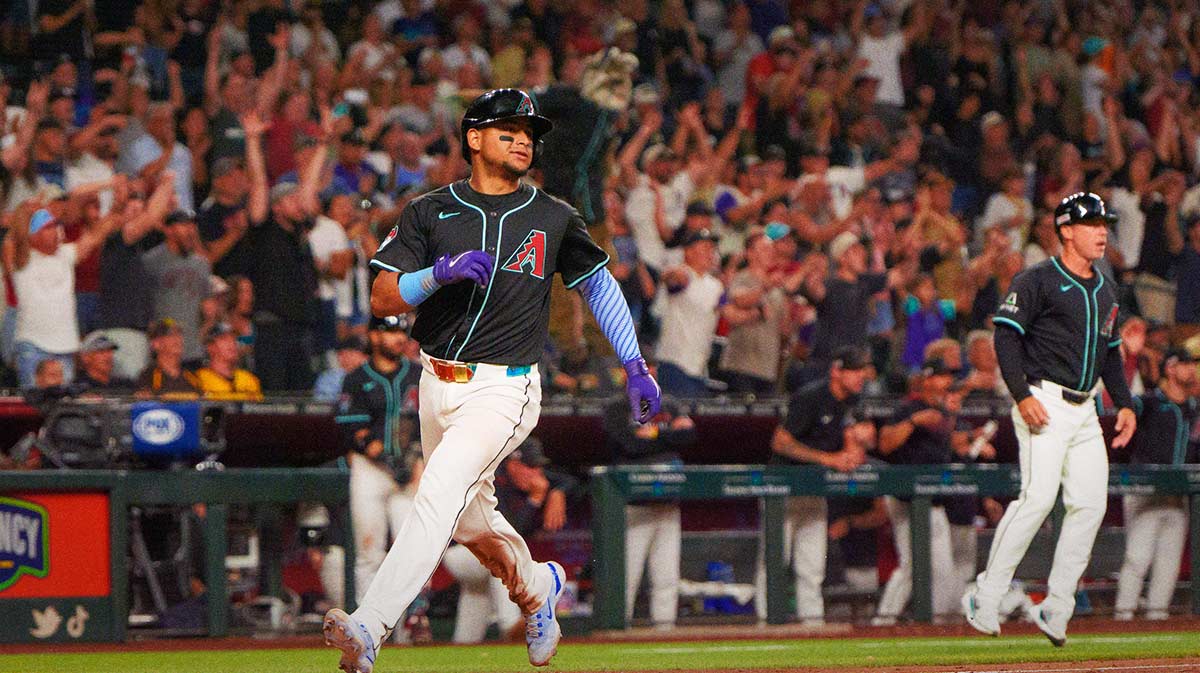 Arizona Diamondbacks catcher Gabriel Moreno (14) comes in to score in the ninth inning against the San Diego Padres at Chase Field.