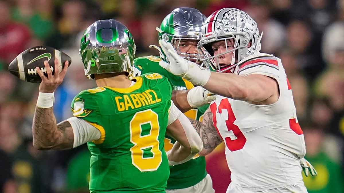 Ohio State Buckeyes defensive end Jack Sawyer (33) pursues Oregon Ducks quarterback Dillon Gabriel (8) during the College Football Playoff quarterfinal at the Rose Bowl in Pasadena, Calif. on Jan. 1, 2025. Ohio State won 41-21.