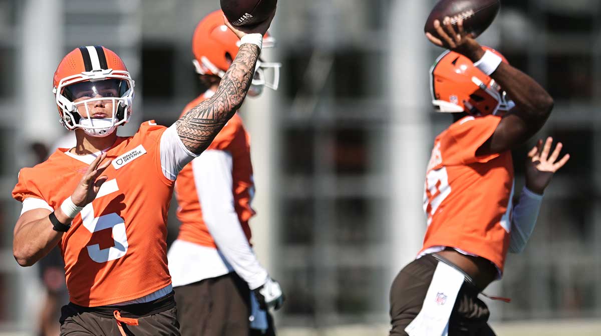 Cleveland Browns quarterback Dillon Gabriel (5) and quarterback Shedeur Sanders (12) throw passes during training camp at CrossCountry Mortgage Campus.