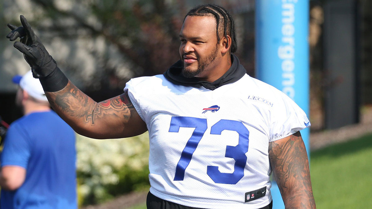 Bills offensive lineman Dion Dawkins waves to fans as he heads to the field on the opening day of Buffalo Bills training camp at St. John Fisher University in Pittsford