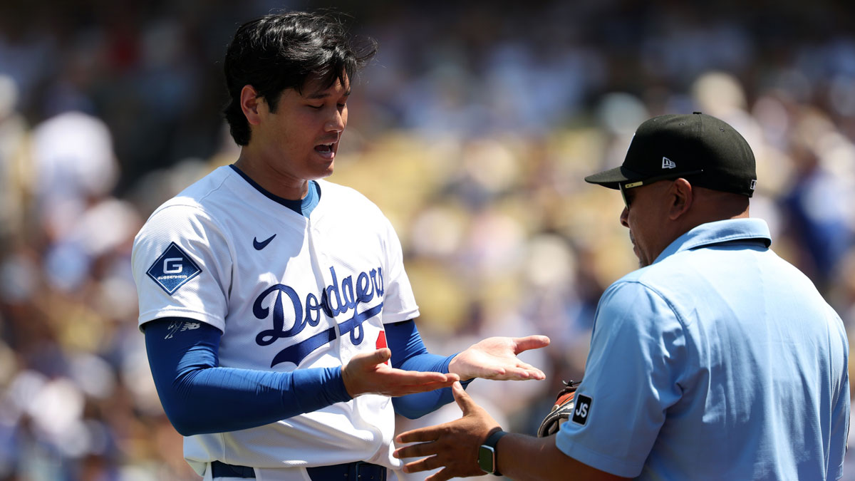 Los Angeles Dodgers two-way player Shohei Ohtani (17) is being checked an umpire after pitching in the fourth inning against the St. Louis Cardinals at Dodger Stadium.