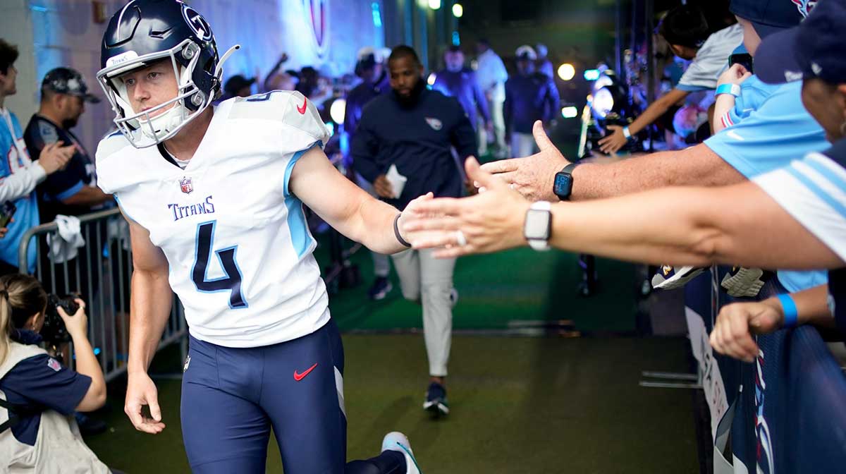 Tennessee Titans punter Ryan Stonehouse (4) heads to the field to face the Los Angeles Chargers at Nissan Stadium.
