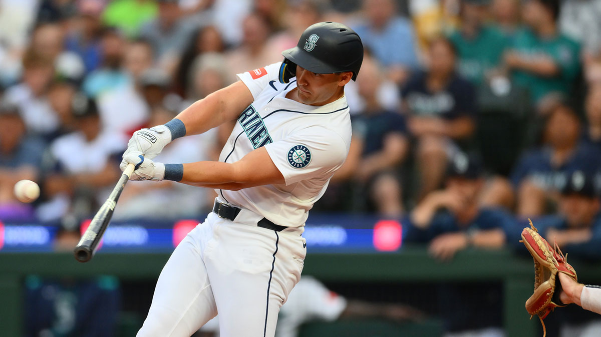 Aug 5, 2025; Seattle, Washington, USA; Seattle Mariners right fielder Dominic Canzone (8) hits a home run against the Chicago White Sox during the second inning at T-Mobile Park. 