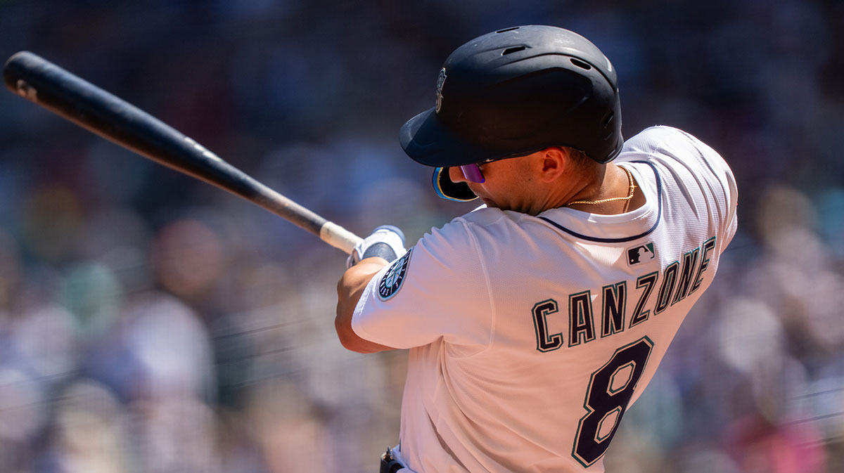 Seattle Mariners right fielder Dominic Canzone (8) hits a RBI double during the second inning Milwaukee Brewers at T-Mobile Park.