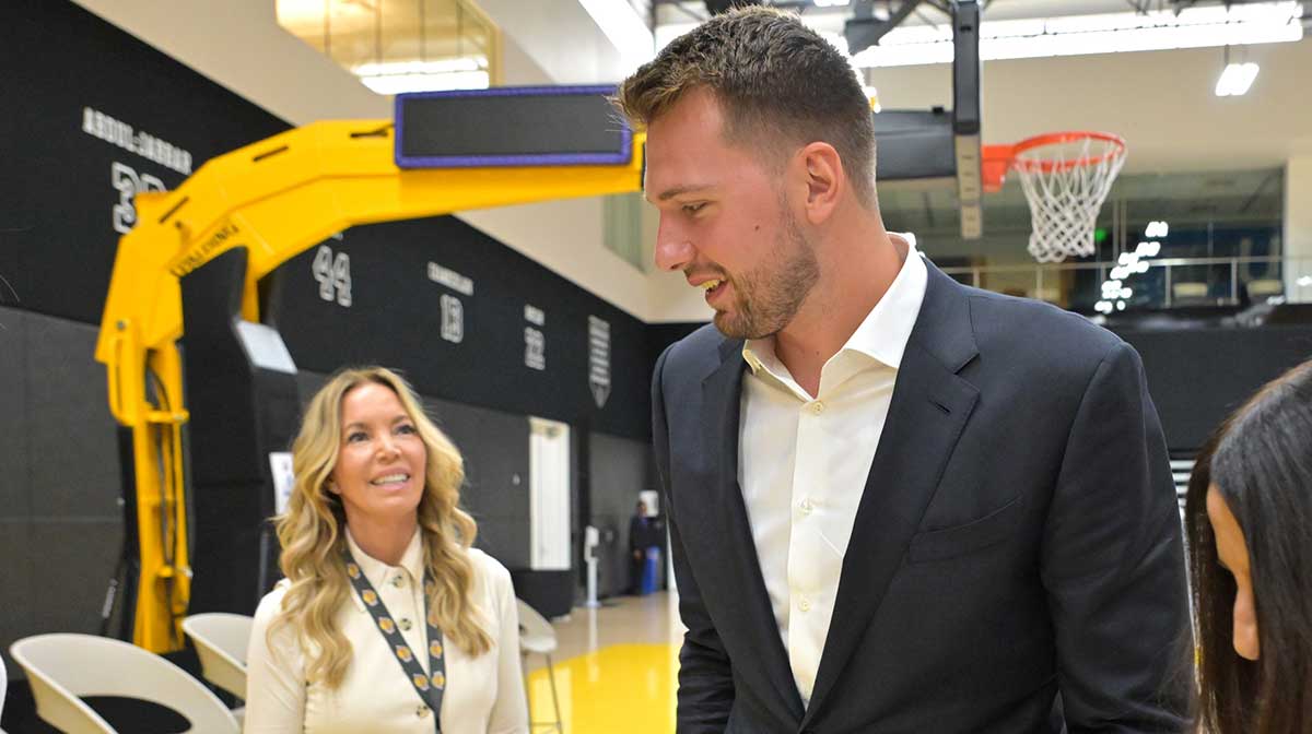Los Angeles Lakers Luka Doncic (77) talks with team co-owner Jeanie Buss following a press conference announcing the signing of a 3-year, $165 million contract extension at UCLA Health Training Center.